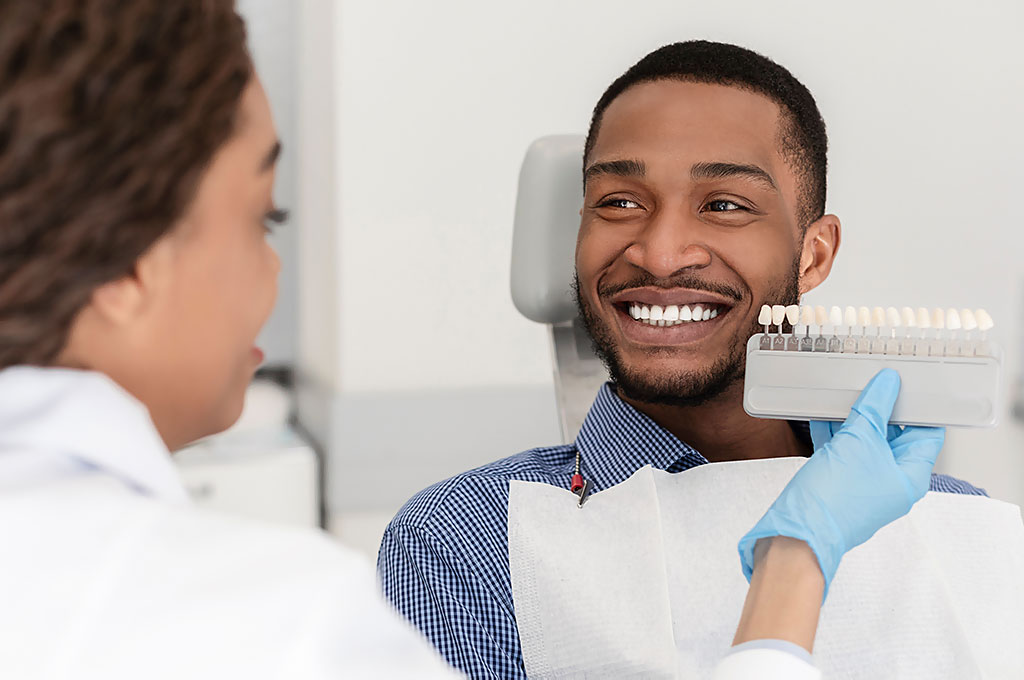 Patient discussing his smile with a dental professional