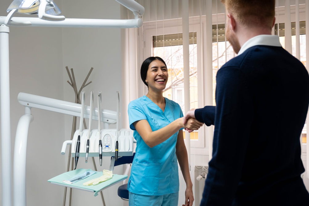 Dental team welcoming a patient
