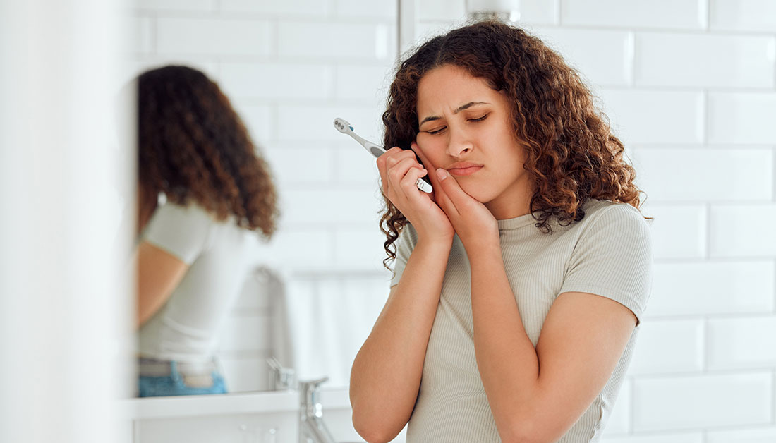 woman dealing with cavity pain
