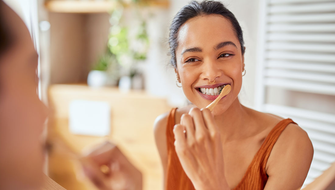 woman brushing her teeth