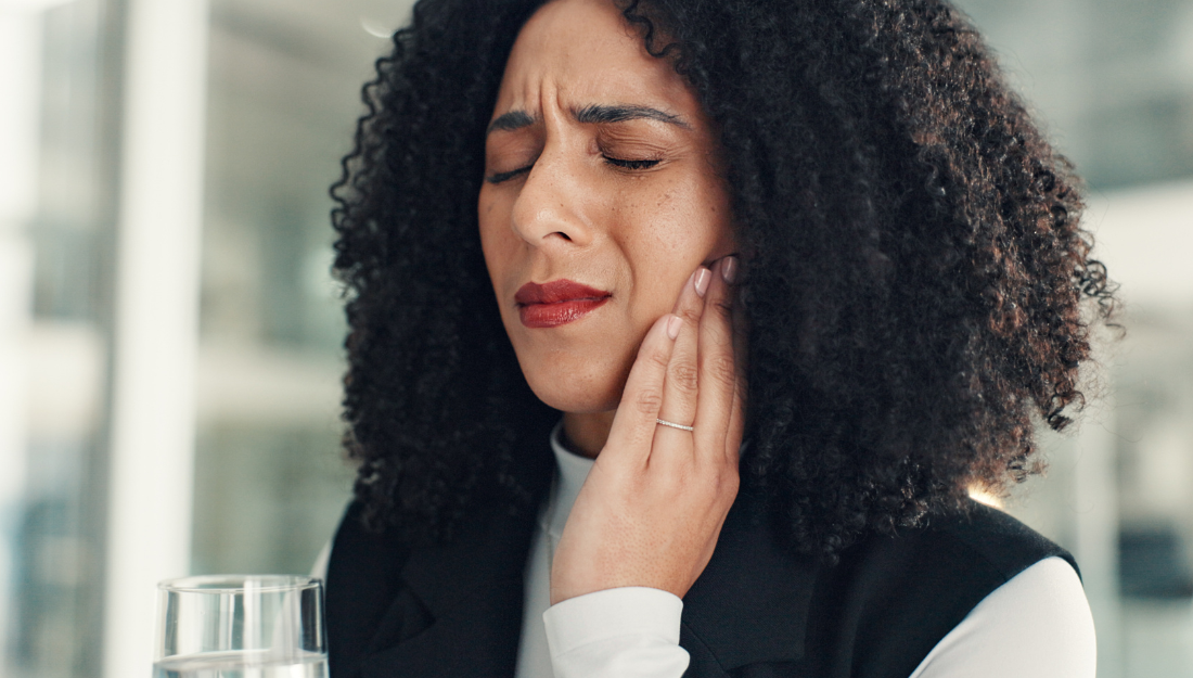 woman dealing with tooth pain
